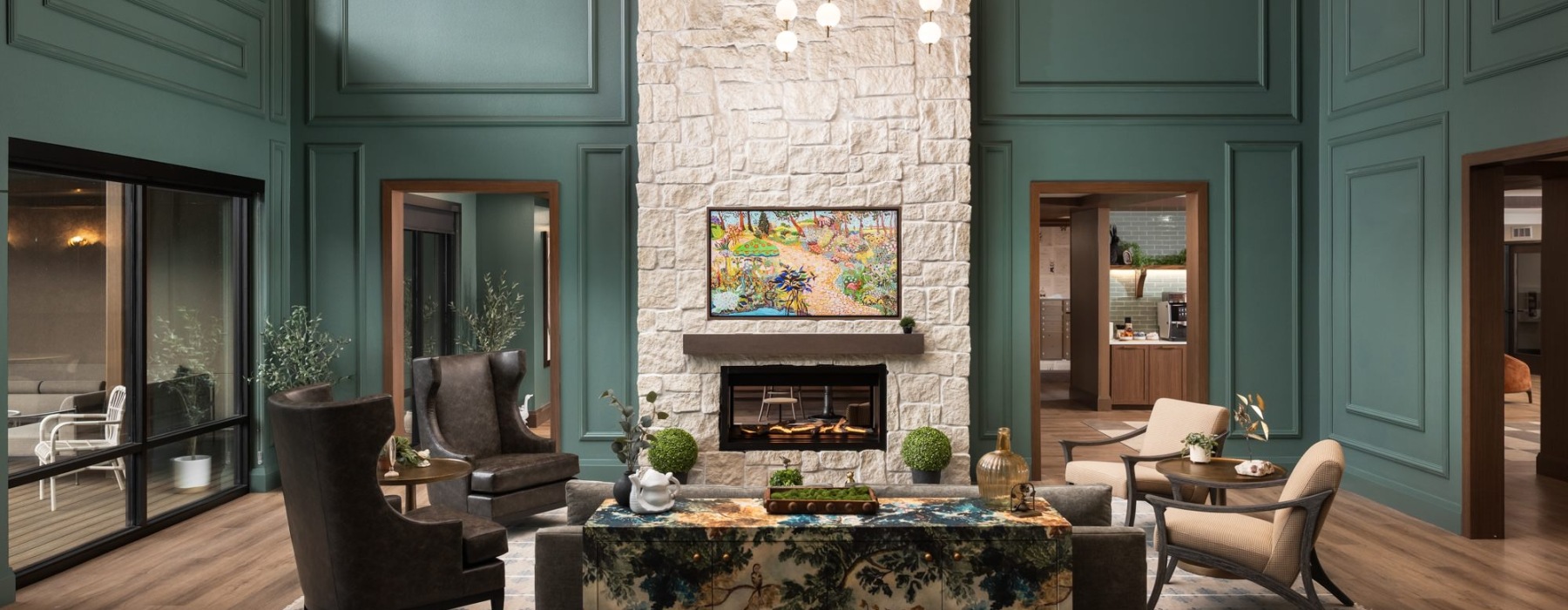a spacious lounge with a fireplace