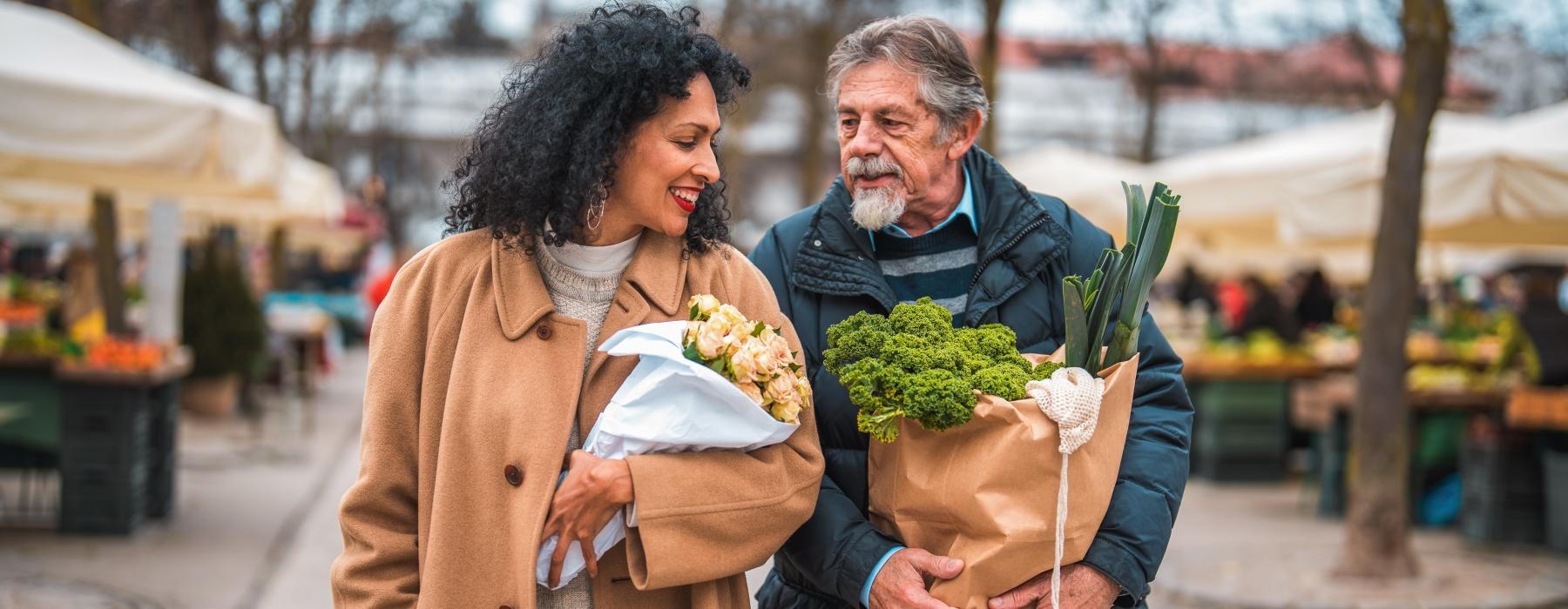 Man and women carrying bags 