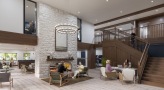 community lounge area with seating and a large staircase