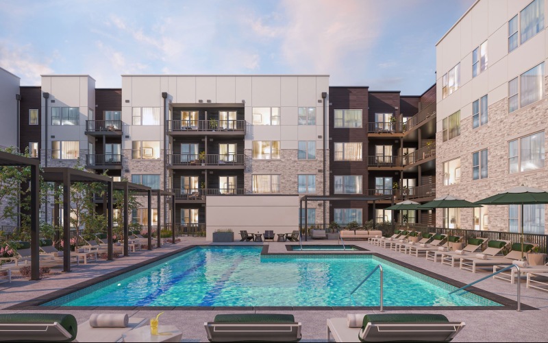 swimming pool in a courtyard with lounge chairs