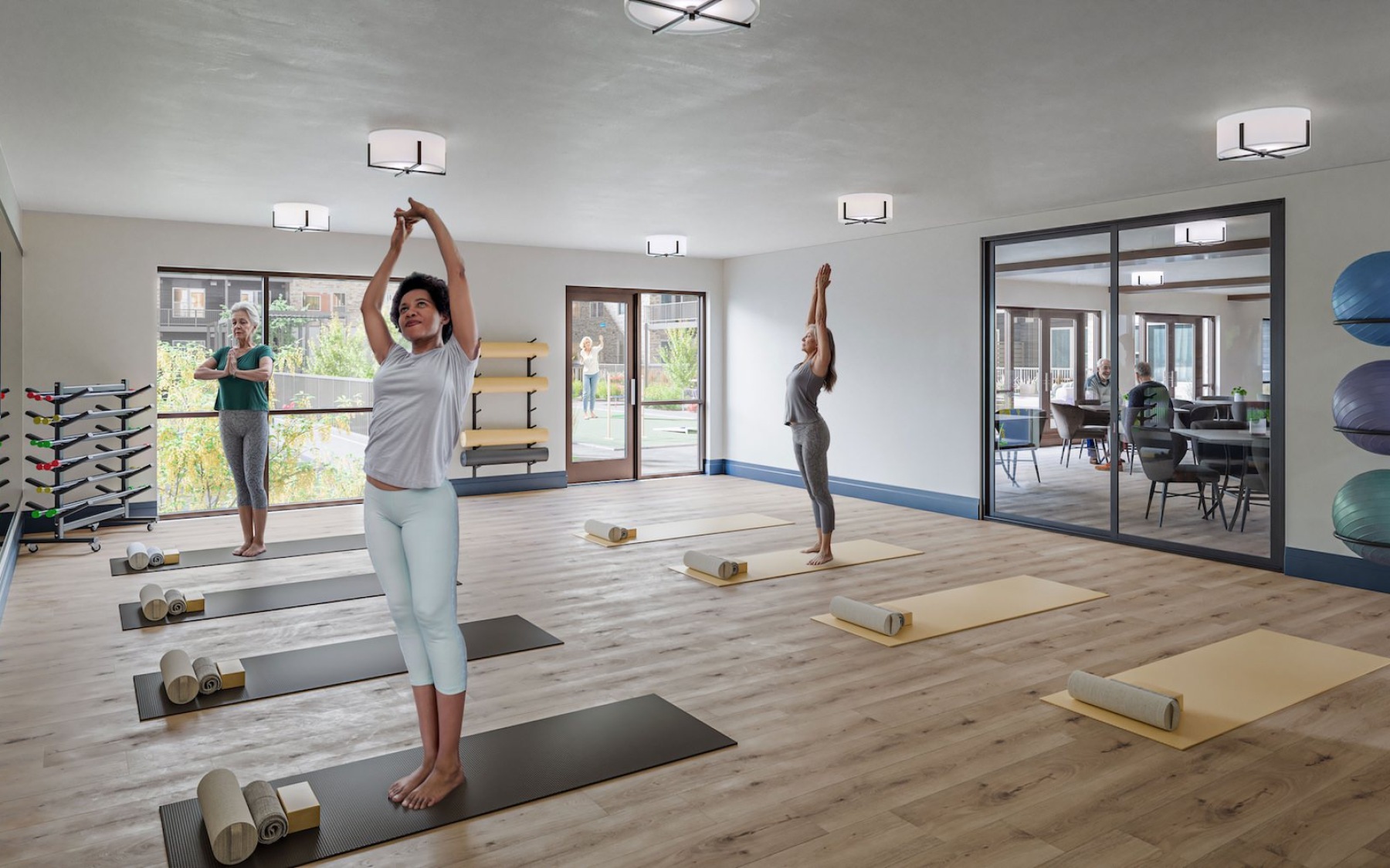 Residents participating in a yoga class at Aspendale Northglenn 55 plus apartments in Northglenn, CO.