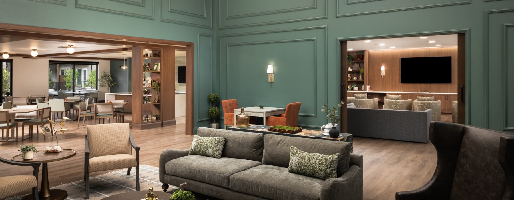 an stunning sitting lounge near a dining area and theater