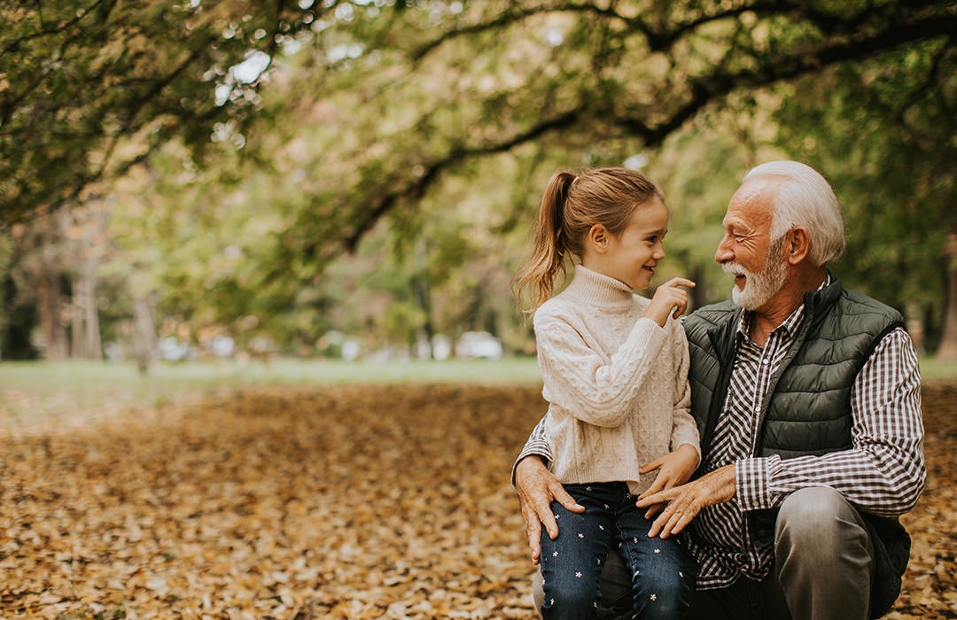 Grandfather sitting with his grandchild 