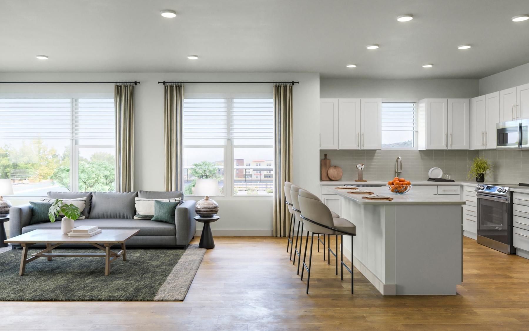 a large kitchen with a couch and a table