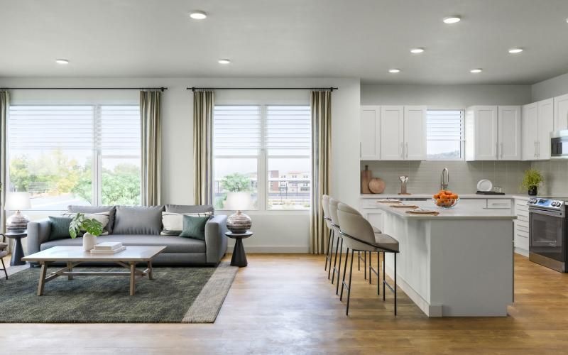 a large kitchen with a couch and a table