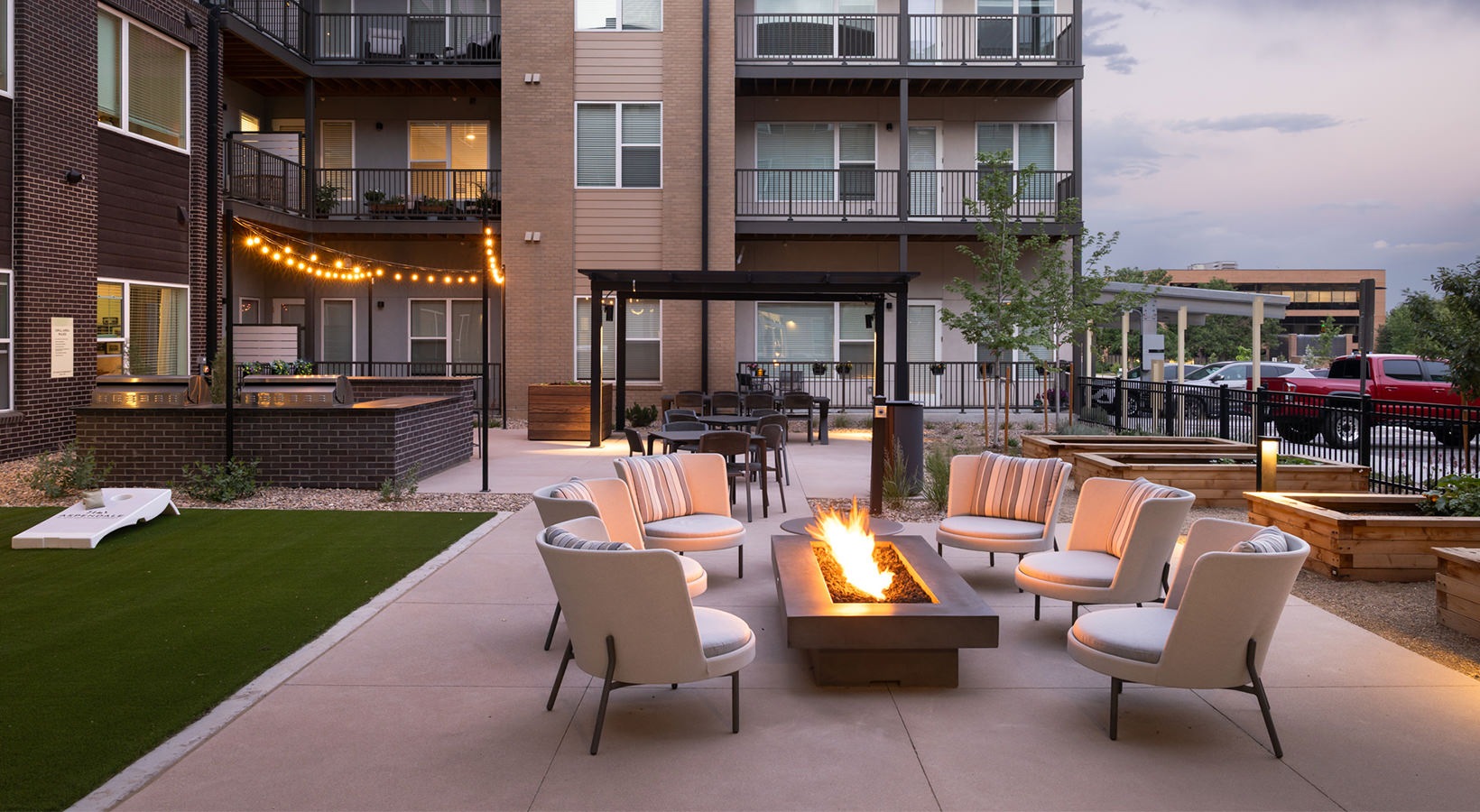 a firepit with chairs surrounding it