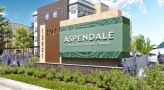 Entrance sign at Aspendale Centennial senior living apartments for rent in Centennial, CO featuring a view of the apartments.
