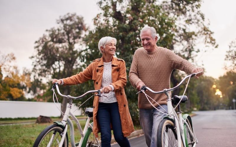 older couple riding bikes together