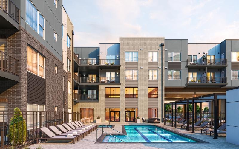 Sparkling blue pool with large pool deck 